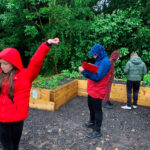 schoolchildren and the herb box at Goldthorpe Embankment