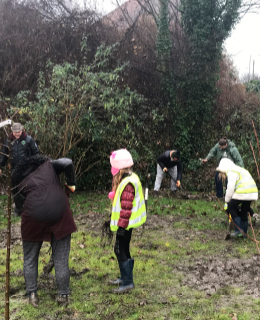 schoolchildren helping to plant orchard at goldthorpe embankment