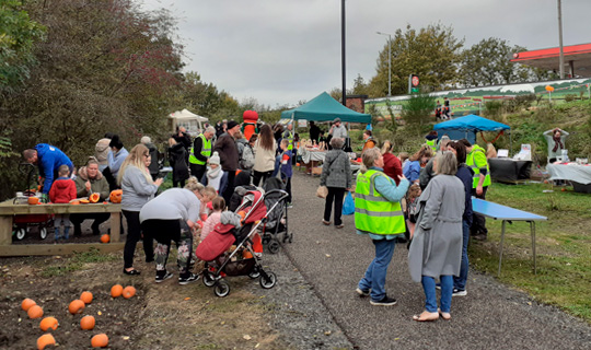 visitors and pumpkin carving at goldthorpe railway embankment autumn fair